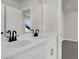 Modern bathroom boasts a double sink vanity with sleek black fixtures at 5206 Cottage Lndg Dr, Summerville, SC 29485