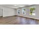 Bedroom featuring wood-look flooring and bright, natural light from the large windows at 5206 Cottage Lndg Dr, Summerville, SC 29485