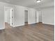 Expansive bedroom with neutral paint and wood-look floors features multiple doorways at 5206 Cottage Lndg Dr, Summerville, SC 29485
