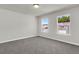 A cozy bedroom with natural light showcases views from the double windows at 5206 Cottage Lndg Dr, Summerville, SC 29485