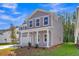 Charming two-story home with gray siding and white trim at 5206 Cottage Lndg Dr, Summerville, SC 29485