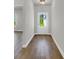 Hallway with hardwood floors and white door leading to backyard at 5206 Cottage Lndg Dr, Summerville, SC 29485