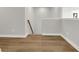 Inviting hallway with wood flooring leads to staircase, showcasing the home's modern design at 5206 Cottage Lndg Dr, Summerville, SC 29485