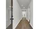 Long hallway featuring hard wood floors and neutral paint at 5206 Cottage Lndg Dr, Summerville, SC 29485