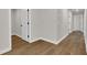 Hallway featuring wood-look flooring and neutral walls that connect the home at 5206 Cottage Lndg Dr, Summerville, SC 29485