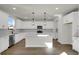 Modern kitchen featuring white cabinets, stainless steel appliances, pendant lighting and quartz countertops at 5206 Cottage Lndg Dr, Summerville, SC 29485