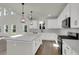 Bright kitchen featuring stainless steel appliances, quartz countertops and island with pendant lighting at 5206 Cottage Lndg Dr, Summerville, SC 29485
