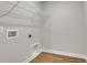 Utility room featuring wood-look flooring and a white wire shelf at 5206 Cottage Lndg Dr, Summerville, SC 29485