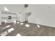 Spacious living room open to the kitchen featuring modern finishes, hardwood floors, and ample natural light at 5206 Cottage Lndg Dr, Summerville, SC 29485