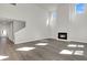 Expansive living room with a fireplace, staircase, and abundant windows, perfect for modern living and entertaining at 5206 Cottage Lndg Dr, Summerville, SC 29485