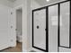Bathroom with black-framed glass shower and subway tile at 5206 Cottage Lndg Dr, Summerville, SC 29485