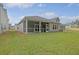 Expansive backyard featuring a screened porch, perfect for outdoor relaxation at 5213 Cottage Lndg Dr, Summerville, SC 29485