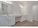 Bright bathroom featuring double sink vanity with white cabinets and modern lighting at 5213 Cottage Lndg Dr, Summerville, SC 29485