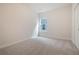 A carpeted bedroom with a window providing natural light and a view of the neighborhood at 5213 Cottage Lndg Dr, Summerville, SC 29485