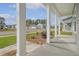Inviting front porch view showcasing the neighborhood and attractive landscaping at 5213 Cottage Lndg Dr, Summerville, SC 29485