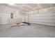 Spacious, unfinished two-car garage awaits your personal touches and vehicle storage at 5213 Cottage Lndg Dr, Summerville, SC 29485