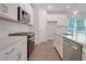 Well-equipped kitchen with white cabinets, stainless steel appliances, and a modern design at 5213 Cottage Lndg Dr, Summerville, SC 29485