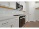 A modern kitchen with white cabinets, stainless steel appliances, and bright white countertops at 5213 Cottage Lndg Dr, Summerville, SC 29485