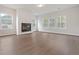 Spacious living room with ample natural light and a cozy fireplace centerpiece at 5213 Cottage Lndg Dr, Summerville, SC 29485