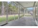 Relaxing screened porch with views of the private backyard and surrounding landscape at 5213 Cottage Lndg Dr, Summerville, SC 29485