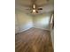 Cozy bedroom with updated flooring, a ceiling fan, and neutral paint at 6983 Vista Ct, North Charleston, SC 29406