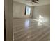Bright bedroom featuring new laminate flooring, a window and ceiling fan at 6983 Vista Ct, North Charleston, SC 29406