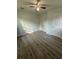 Light and airy bedroom featuring new flooring, a ceiling fan, and two closets at 6983 Vista Ct, North Charleston, SC 29406