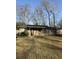 Charming single-story brick home with a cozy front porch and mature trees at 6983 Vista Ct, North Charleston, SC 29406
