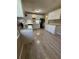Kitchen boasts updated cabinets, mosaic backsplash, and new laminate flooring at 6983 Vista Ct, North Charleston, SC 29406