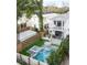 Aerial view of a beautiful home with a swimming pool, spa, and landscaped backyard in a desirable neighborhood at 71 Moultrie St, Charleston, SC 29403