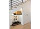 Under-stair storage area with a dog bed and a wicker basket at 71 Moultrie St, Charleston, SC 29403