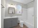 Well-lit bathroom with a vanity, mirror, toilet, and shower-tub combo at 867 Colony Dr # F-82, Charleston, SC 29407