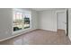 Bedroom featuring neutral walls, tile floors, and a window looking out to the community at 867 Colony Dr # F-82, Charleston, SC 29407