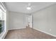 Clean bedroom featuring neutral paint, tile floor, window, and ceiling fan at 867 Colony Dr # F-82, Charleston, SC 29407