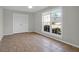 Bright bedroom featuring a large window, closet, and tile flooring at 867 Colony Dr # F-82, Charleston, SC 29407