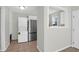 View of the kitchen with a refrigerator and laundry appliance, connected to other rooms at 867 Colony Dr # F-82, Charleston, SC 29407