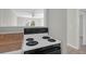 View of the kitchen, separated from other rooms with a breakfast bar and stove at 867 Colony Dr # F-82, Charleston, SC 29407