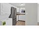 A kitchen boasts white cabinets, stainless steel fridge, and a washer/dryer unit at 867 Colony Dr # F-82, Charleston, SC 29407