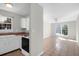 View of the living room and kitchen featuring tile flooring and light neutral paint at 867 Colony Dr # F-82, Charleston, SC 29407