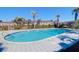 A sparkling community pool surrounded by ample lounge space, offering a relaxing outdoor retreat for residents at 867 Colony Dr # F-82, Charleston, SC 29407