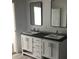 Bathroom vanity featuring dual sinks, modern fixtures, and ample storage for a stylish design at 8833 Cottageville Hwy, Cottageville, SC 29435