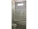 A clean bathroom featuring a bathtub and shower combo with a white surround at 8833 Cottageville Hwy, Cottageville, SC 29435