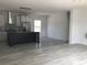 Open-concept living space flowing into a kitchen with an island, perfect for modern living and entertaining at 8833 Cottageville Hwy, Cottageville, SC 29435