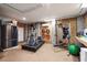 Finished basement area featuring a gym with a treadmill and weight machine, and also a mini-refrigerator at 935 Royall Ave, Mount Pleasant, SC 29464
