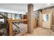 Unfinished basement with ladder, shelving, and doorway at 935 Royall Ave, Mount Pleasant, SC 29464
