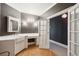Bright bathroom features a large sink, marble countertop, and white cabinets for storage at 935 Royall Ave, Mount Pleasant, SC 29464
