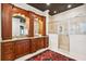 Bathroom showcasing a large glass shower and custom cherry wood cabinetry with granite counters at 935 Royall Ave, Mount Pleasant, SC 29464