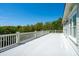 Spacious outdoor deck featuring a white railing and ample space, perfect for relaxing and enjoying scenic views at 935 Royall Ave, Mount Pleasant, SC 29464