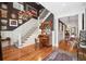 Grand entryway with hardwood floors, staircase, and sophisticated decor at 935 Royall Ave, Mount Pleasant, SC 29464