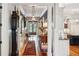 Grand foyer featuring hardwood floors, a long hallway, and elegant lighting at 935 Royall Ave, Mount Pleasant, SC 29464